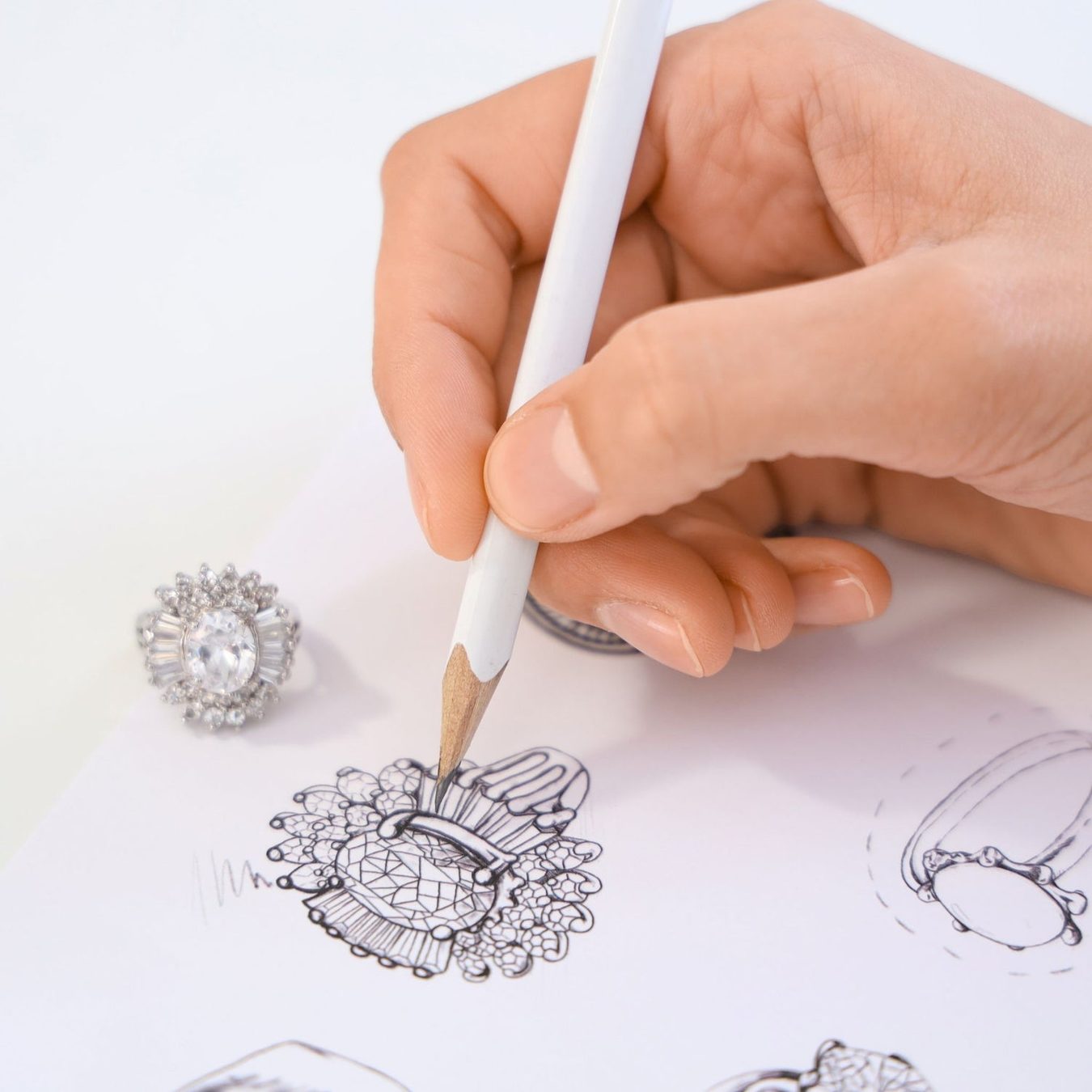 A bespoke design in progress, hand-drawn workings and reference stones, Henley County Jewellers