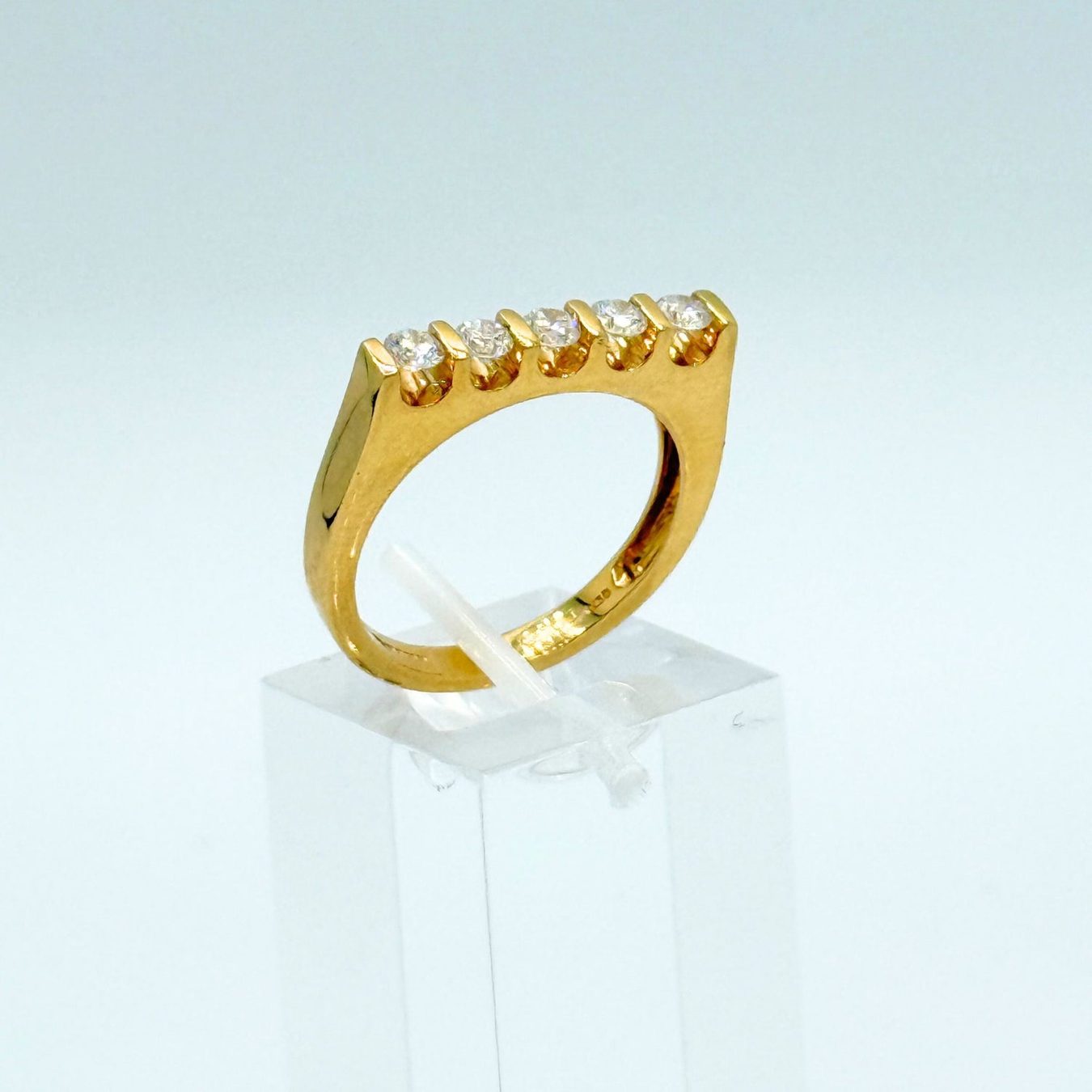 Rings from Henley County Jewellers, photographed on neutral white