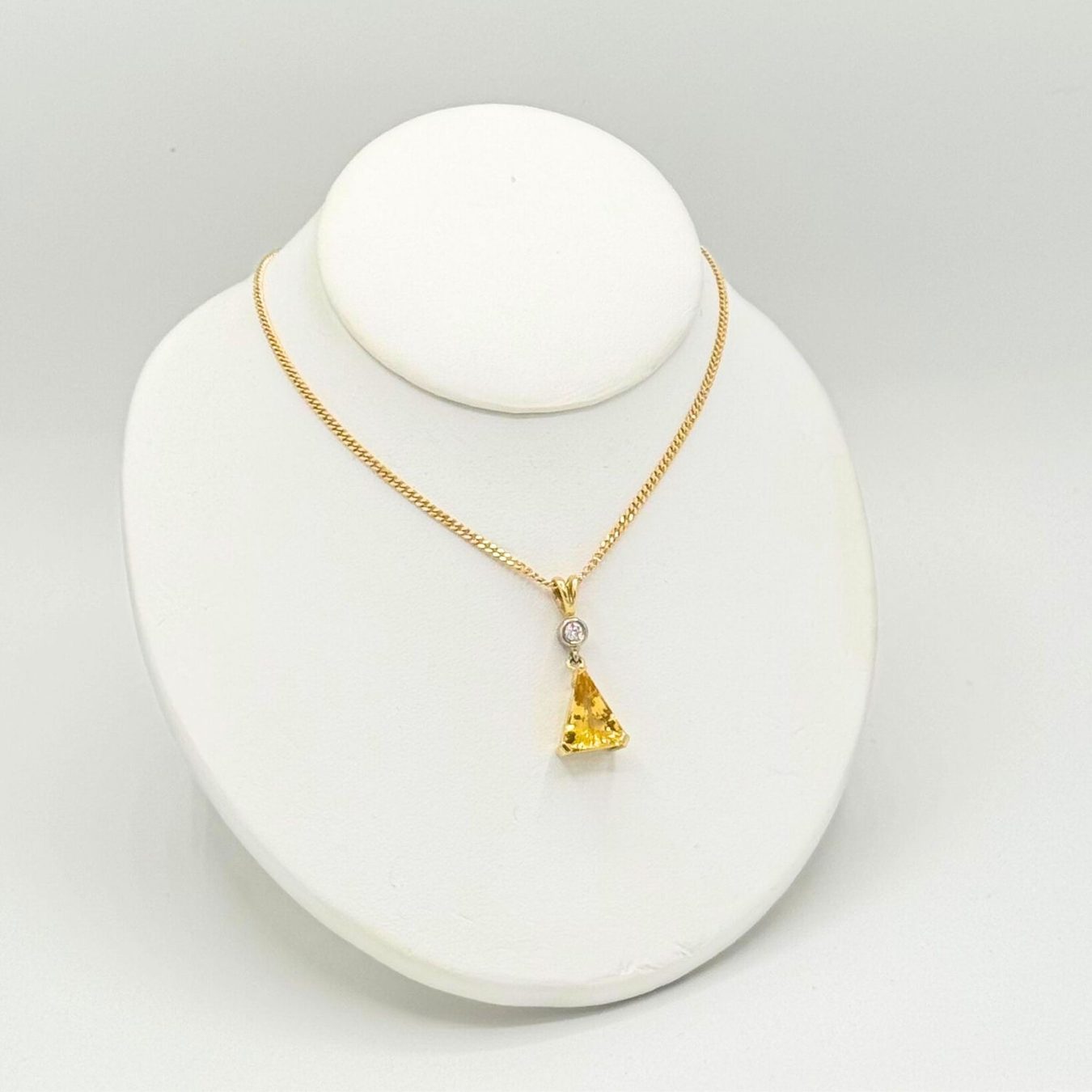 Pendants & bracelets from Henley County Jewellers, photographed on neutral white
