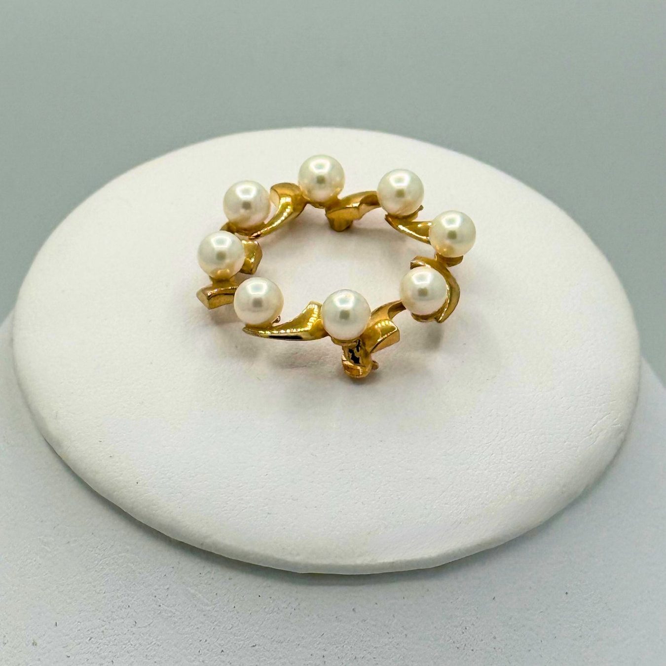Brooches & cufflinks from Henley County Jewellers, photographed on neutral white