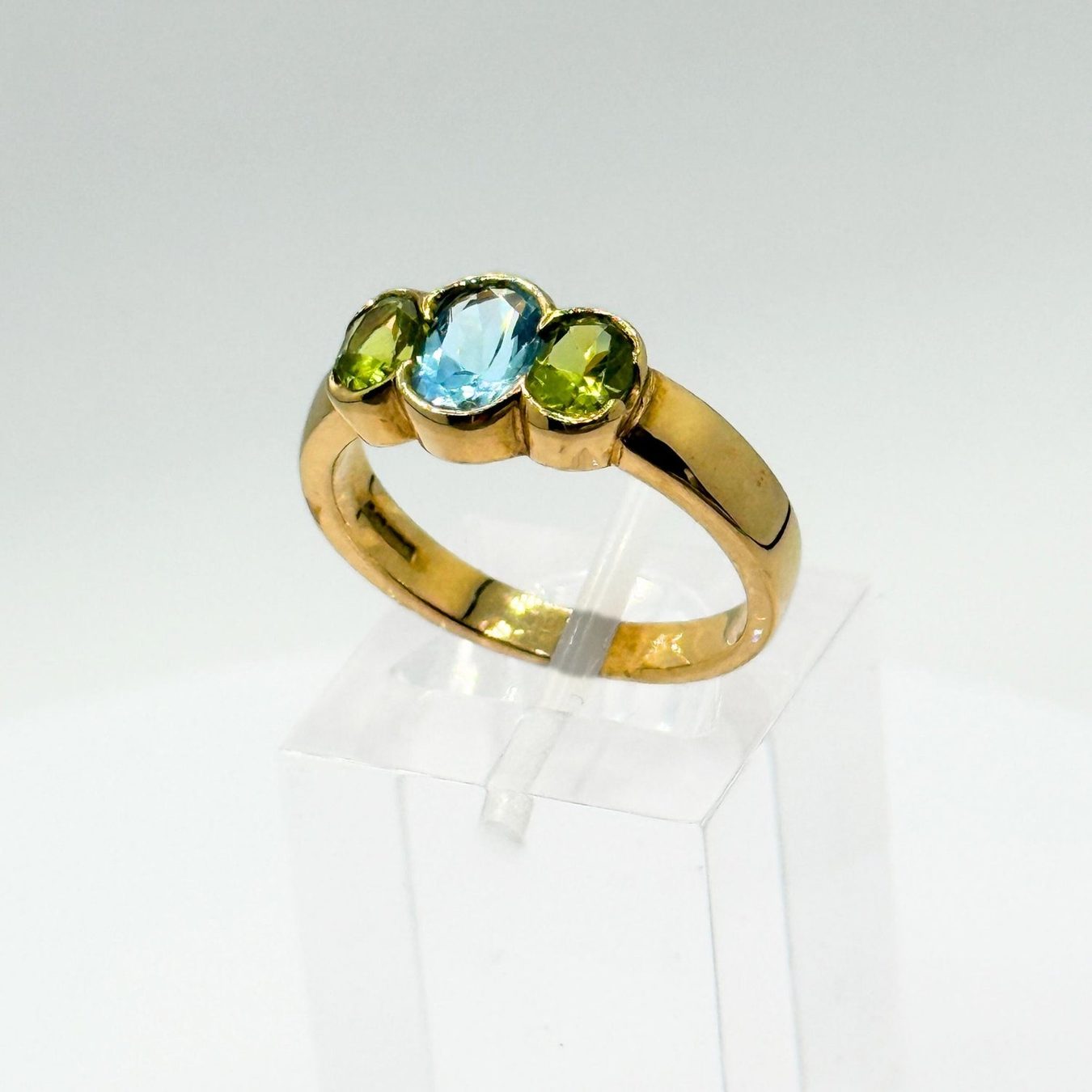 9ct yellow gold  ·  blue topaz with peridot  ·  one only
